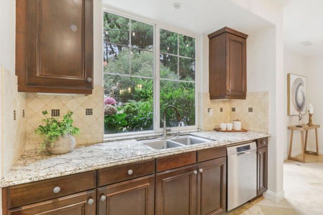a kitchen with sink and window