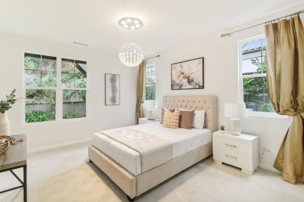 7618 Circulo Sequoia Carlsbad, CA 92009 - Photo 15 of 45 a bedroom with a bed and a large window