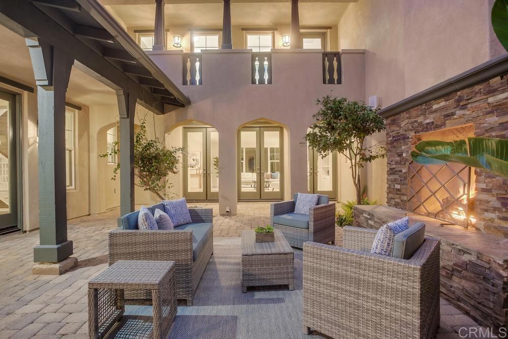 7618 Circulo Sequoia Carlsbad, CA 92009 - Photo 20 of 45 a building outdoor space with patio furniture