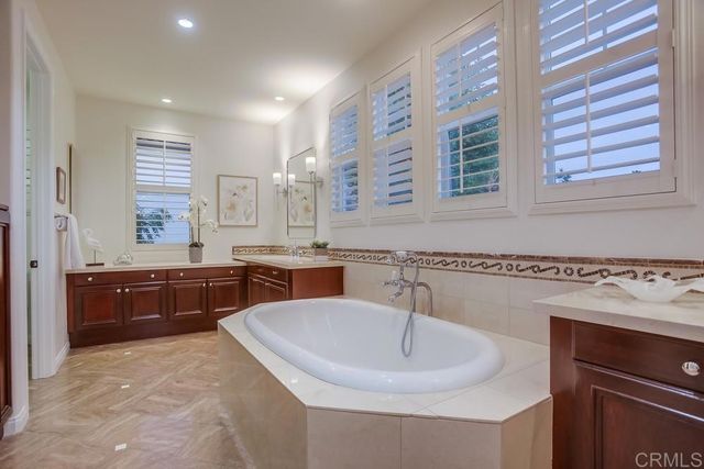 a large kitchen with a sink a counter space and appliances