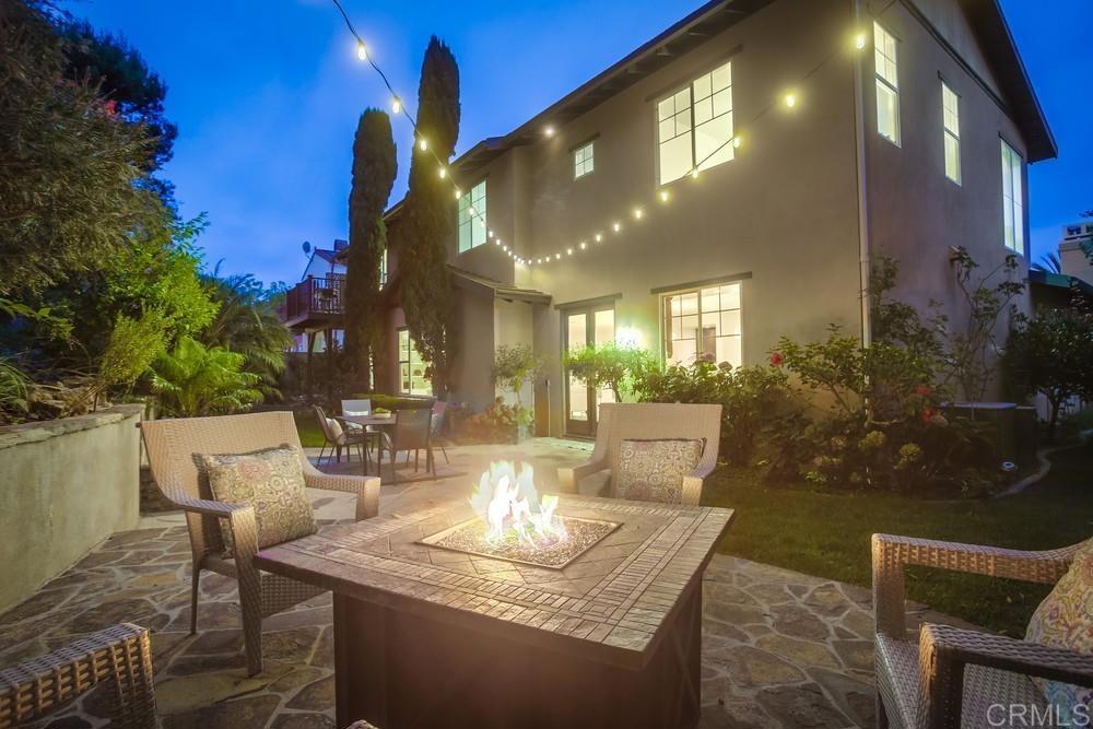 7618 Circulo Sequoia Carlsbad, CA 92009 - Photo 33 of 45 a view of a patio with couches table and chairs and potted plants