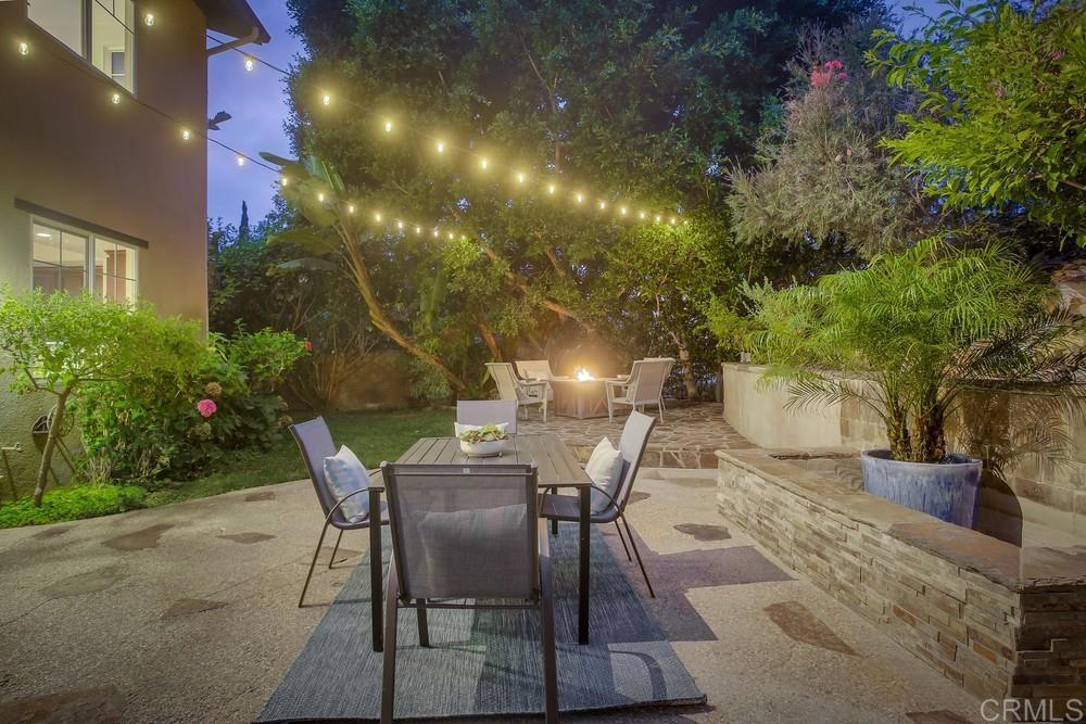 7618 Circulo Sequoia Carlsbad, CA 92009 - Photo 34 of 45 a view of a chairs and table in backyard