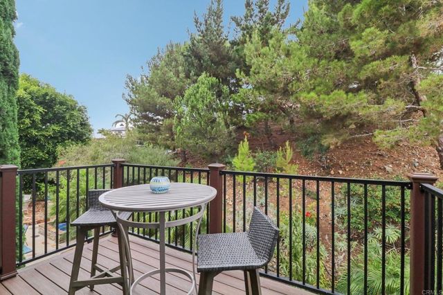 a view of a balcony with furniture