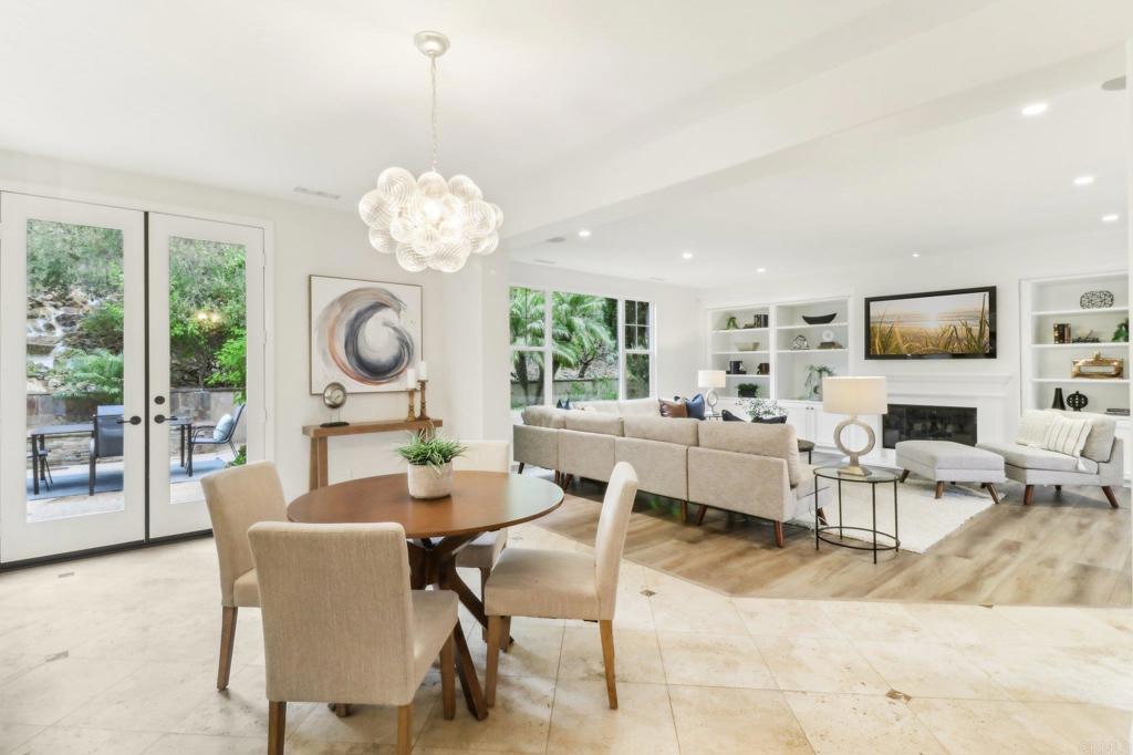7618 Circulo Sequoia Carlsbad, CA 92009 - Photo 6 of 45 a living room with fireplace furniture and a chandelier