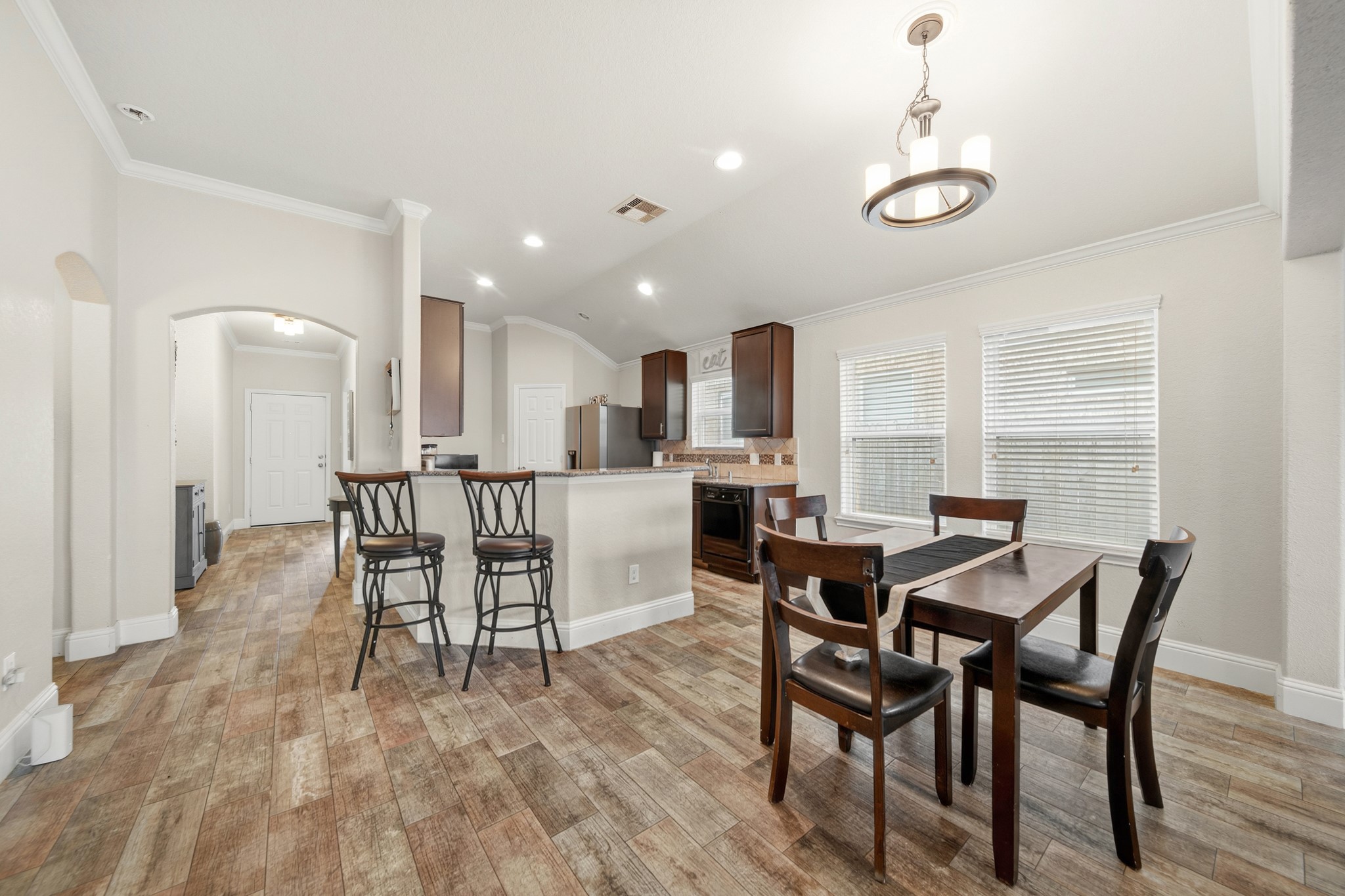 29446 Ridge Clearing Trail Spring, TX 77386 - Photo 14 of 28 Bright dining area with open sightlines to both the kitchen and living room.