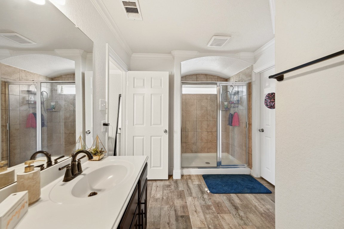 29446 Ridge Clearing Trail Spring, TX 77386 - Photo 20 of 28 a bathroom with a tub sink and shower