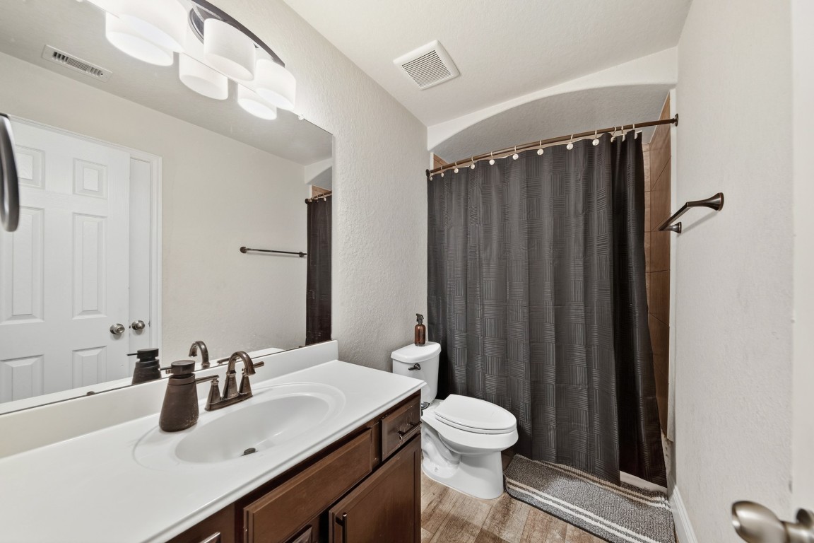 29446 Ridge Clearing Trail Spring, TX 77386 - Photo 24 of 28 a bathroom with a sink a toilet and shower