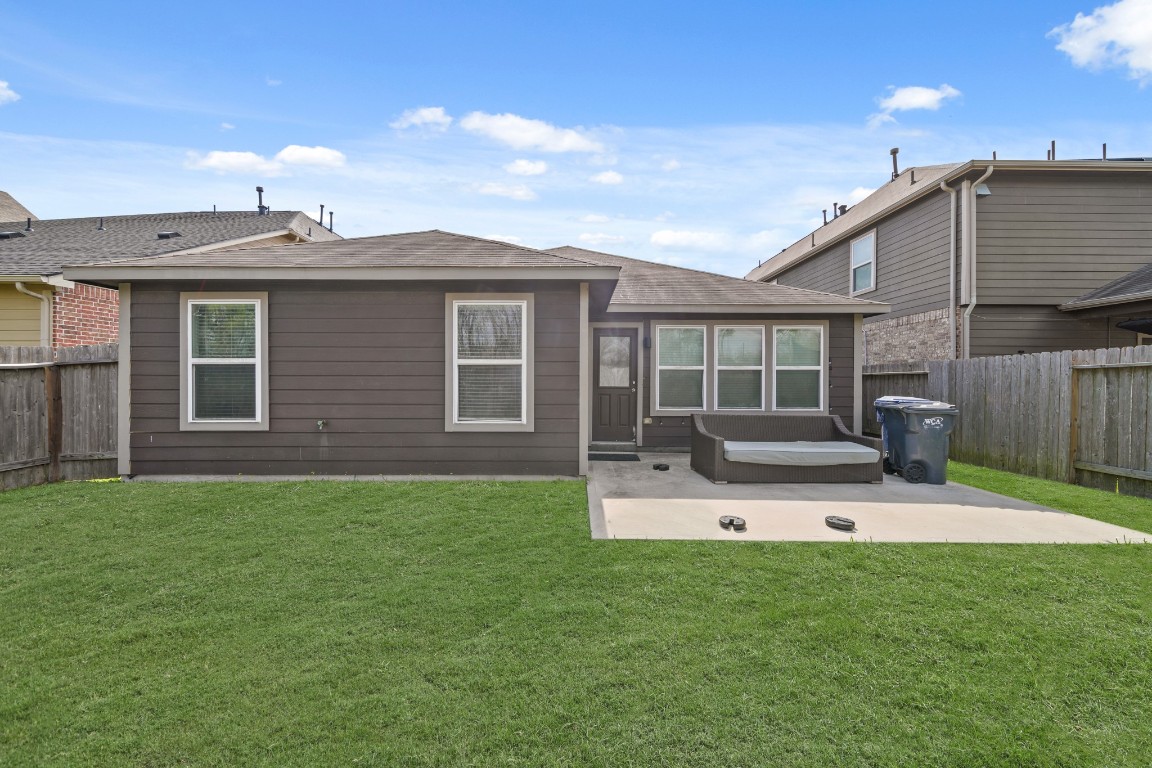 29446 Ridge Clearing Trail Spring, TX 77386 - Photo 25 of 28 a view of a house with a backyard and a patio