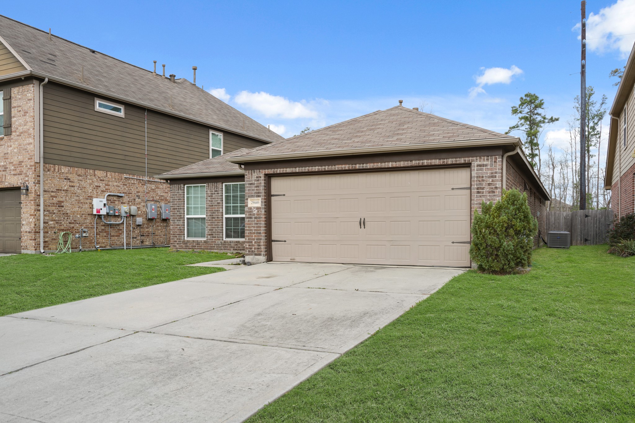 29446 Ridge Clearing Trail Spring, TX 77386 - Photo 3 of 28 Classic brick exterior with a spacious driveway and inviting curb appeal.
