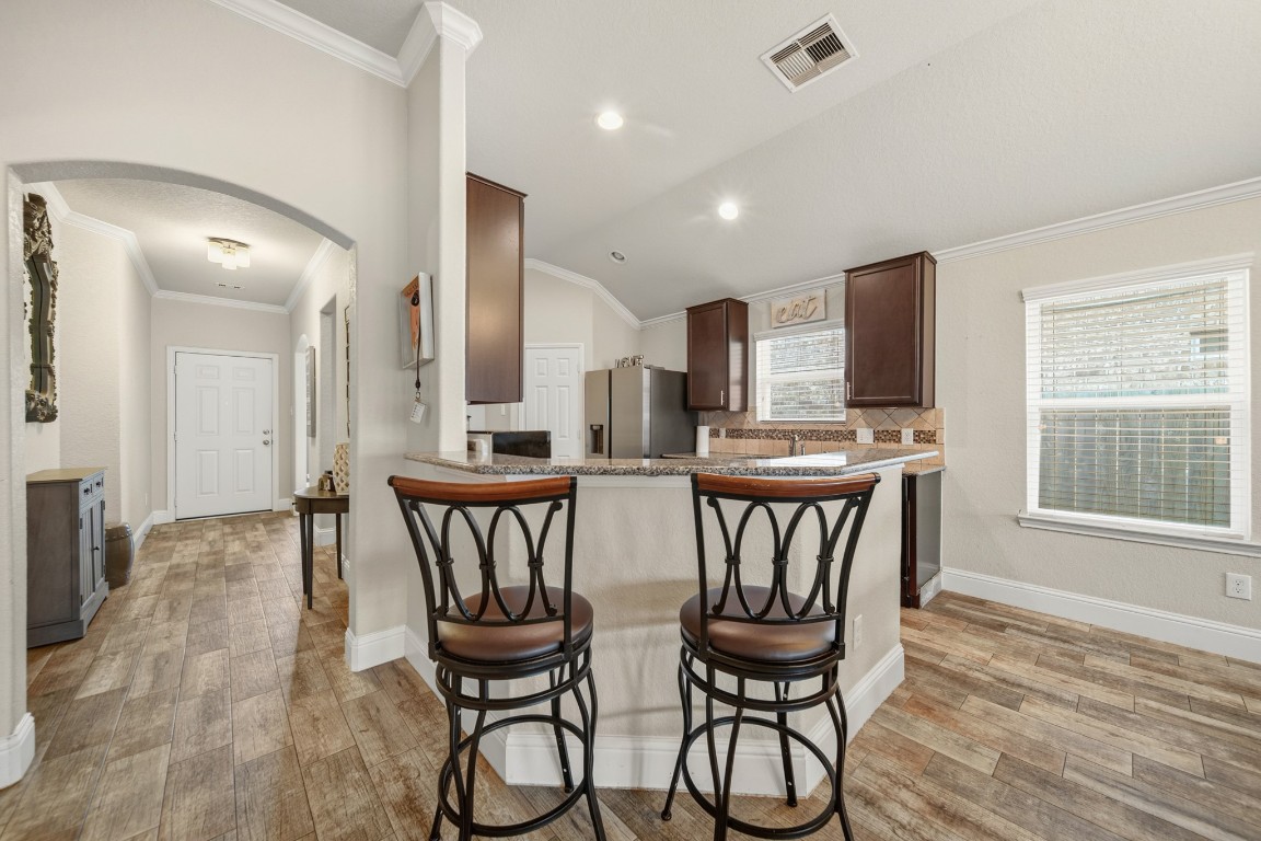29446 Ridge Clearing Trail Spring, TX 77386 - Photo 8 of 28 a view of a dining room with furniture and wooden floor