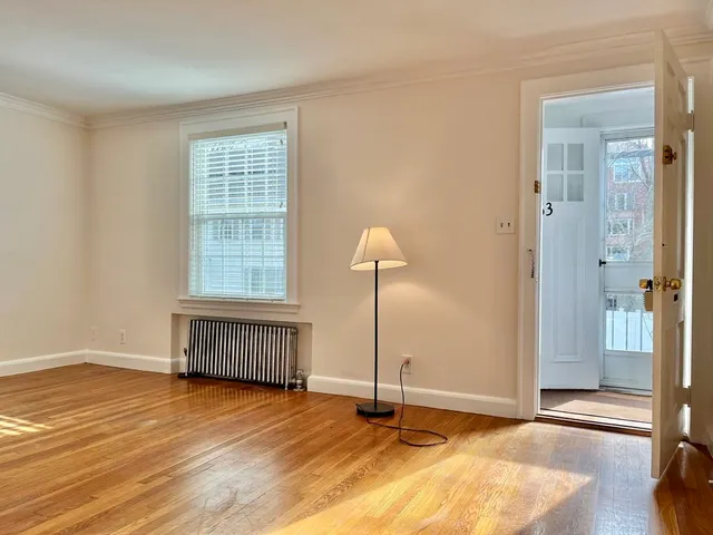 a view of an empty room with glass door