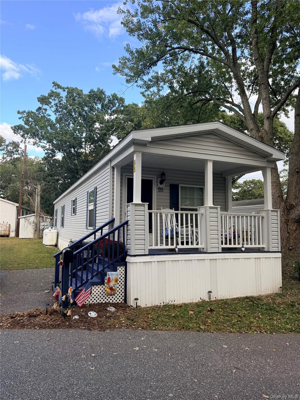 37 Hubbard Avenue, Unit 95 Riverhead, NY 11901 - Photo 1 of 14 Manufactured / mobile home with covered porch