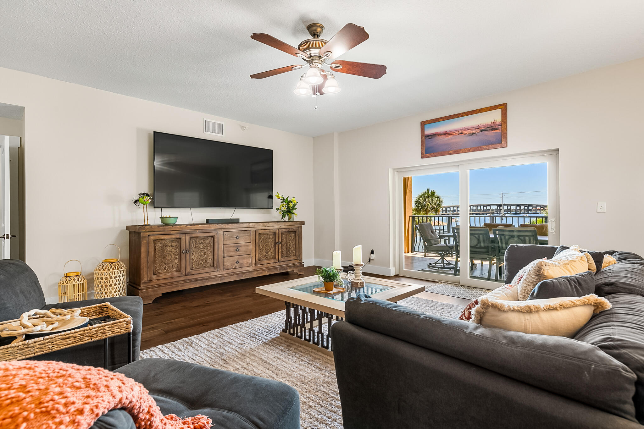 29 Riverside Drive, Unit 201 Cocoa, FL 32922 - Photo 24 of 46 a living room with furniture and a flat screen tv