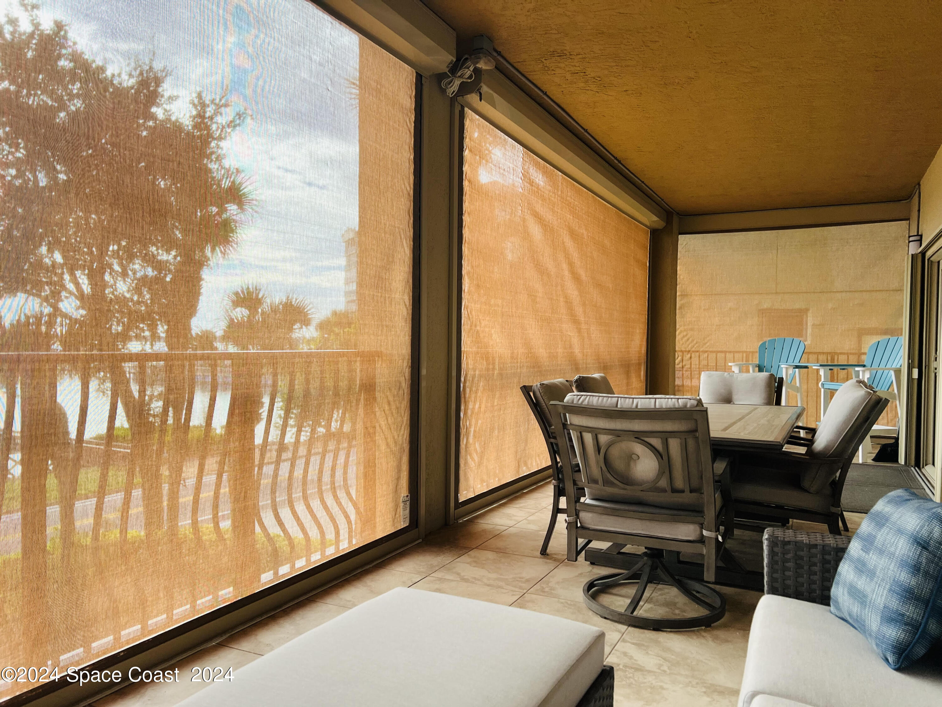 29 Riverside Drive, Unit 201 Cocoa, FL 32922 - Photo 27 of 46 a view of a chairs and table in the balcony