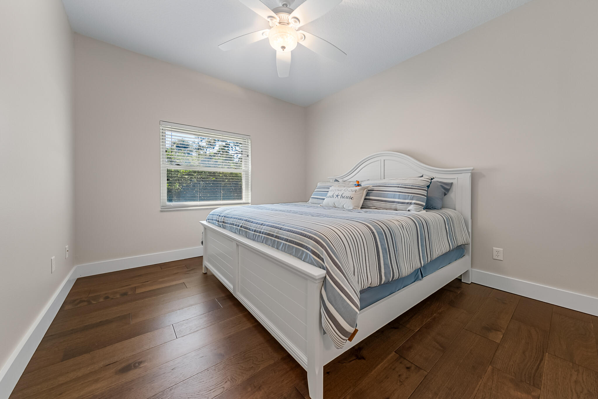 29 Riverside Drive, Unit 201 Cocoa, FL 32922 - Photo 7 of 46 a bedroom with a bed and a window