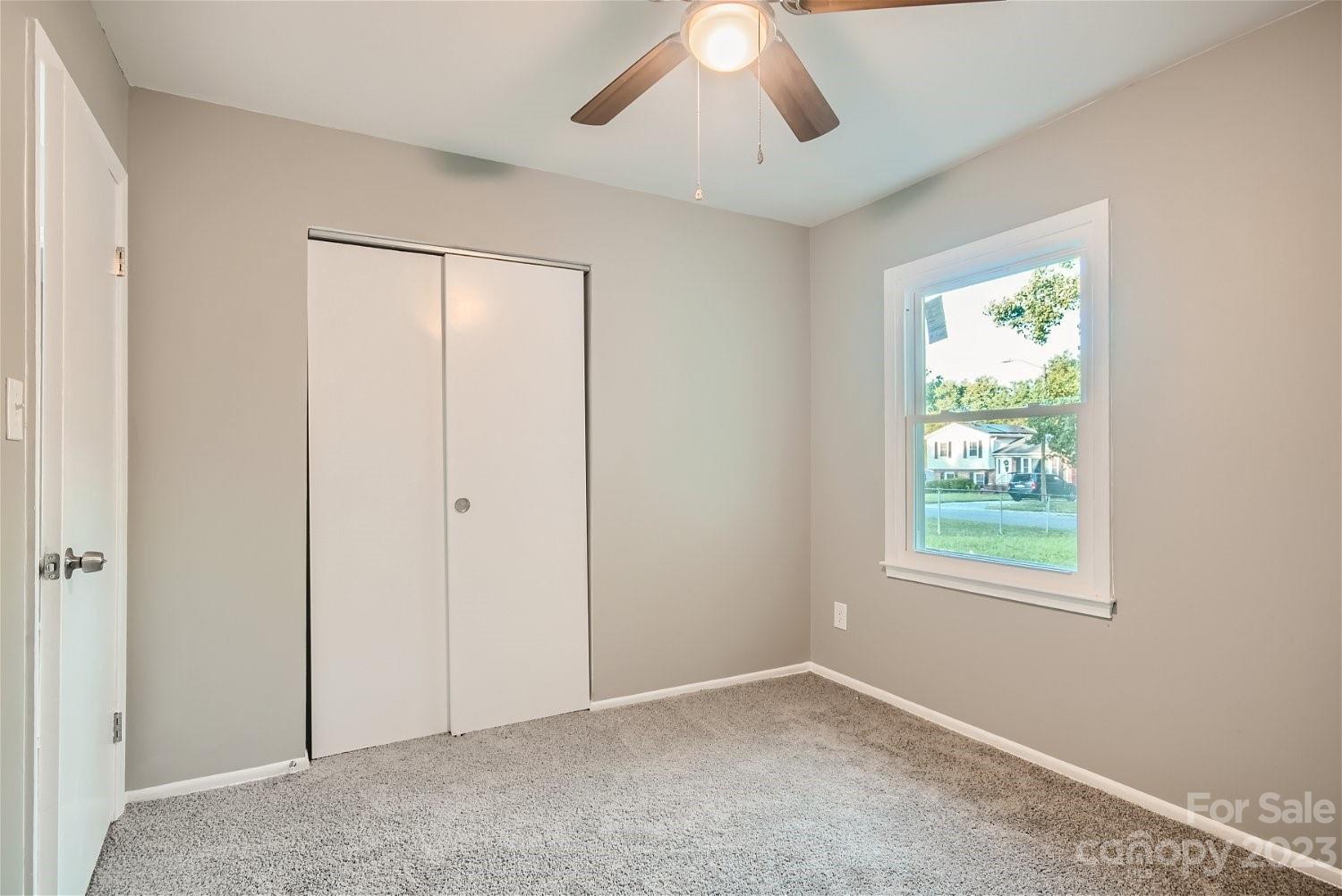 7438 Bramblewood Drive Charlotte, NC 28217 - Photo 20 of 27 an empty room with windows and closet