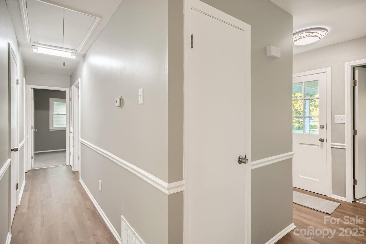 7438 Bramblewood Drive Charlotte, NC 28217 - Photo 23 of 27 a view of a hallway with a white walls