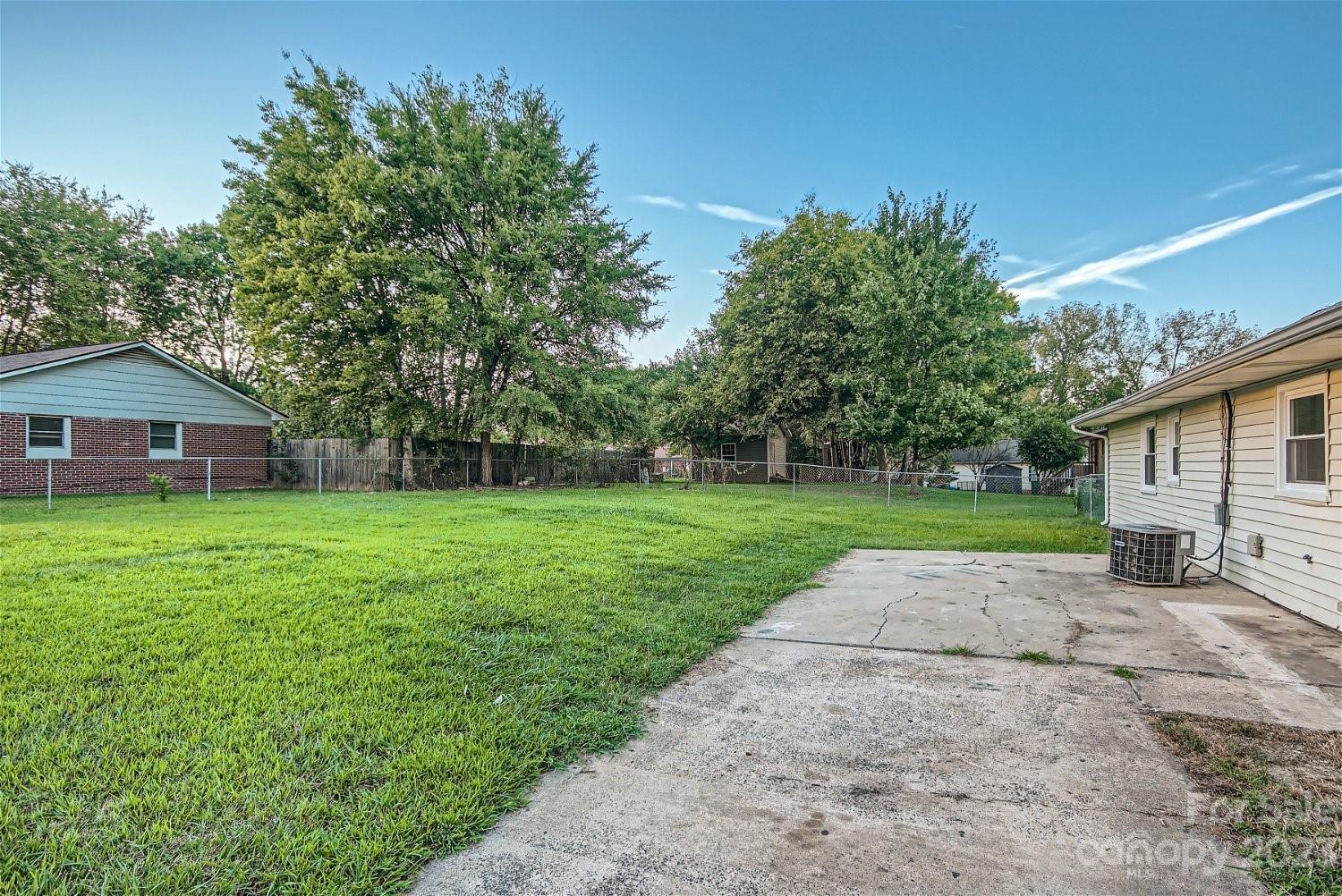 7438 Bramblewood Drive Charlotte, NC 28217 - Photo 25 of 27 a view of a house with a yard