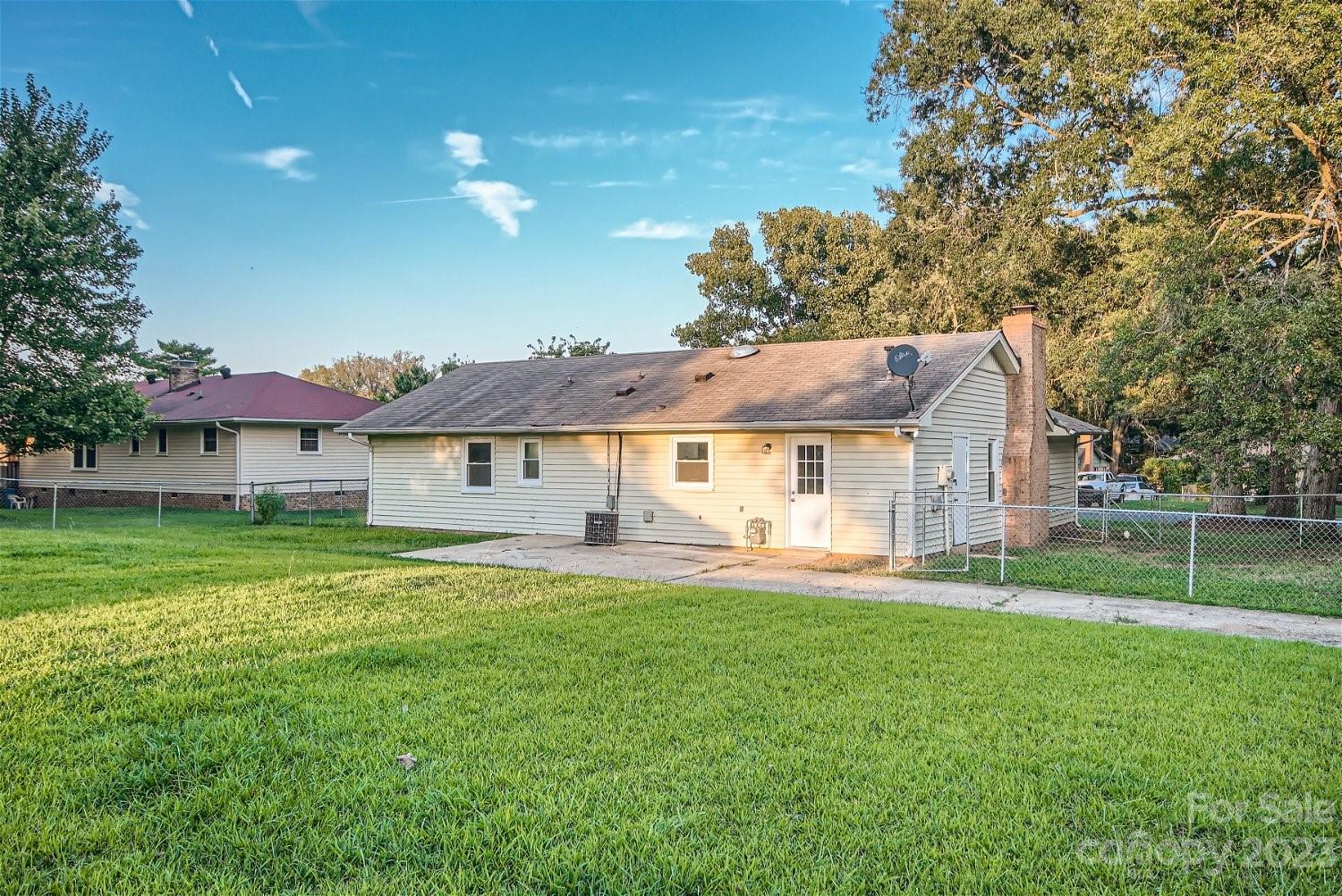 7438 Bramblewood Drive Charlotte, NC 28217 - Photo 26 of 27 a front view of a house with a yard porch and sitting area