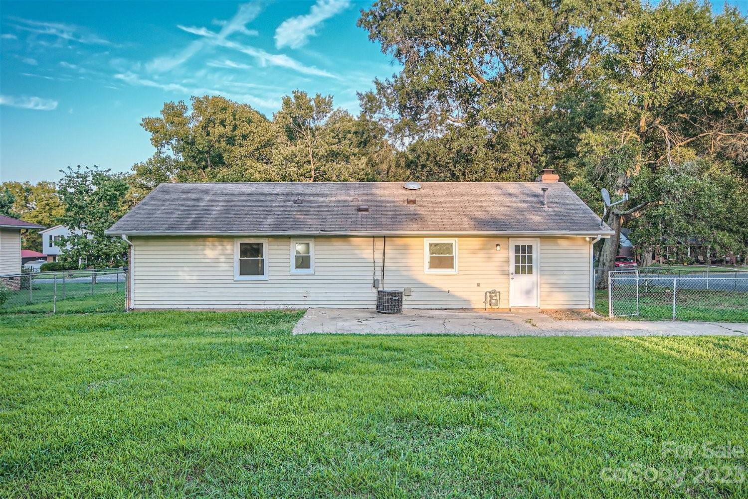 7438 Bramblewood Drive Charlotte, NC 28217 - Photo 27 of 27 a front view of house with yard and seating area