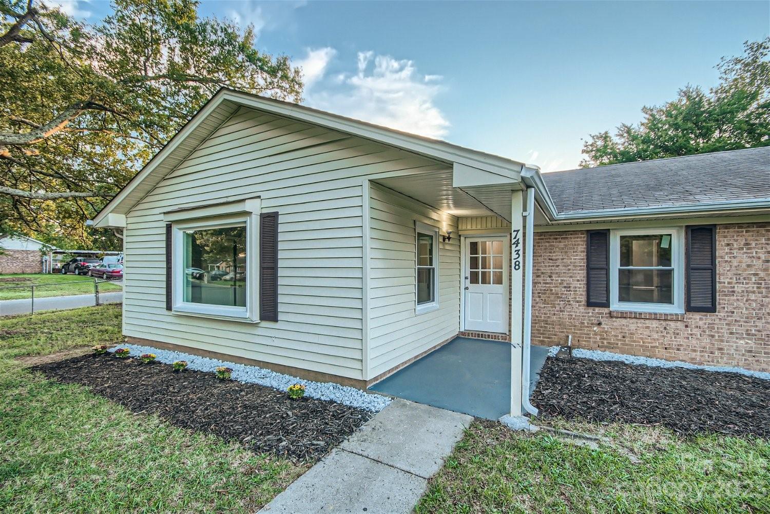 7438 Bramblewood Drive Charlotte, NC 28217 - Photo 3 of 27 a view of a house with a yard