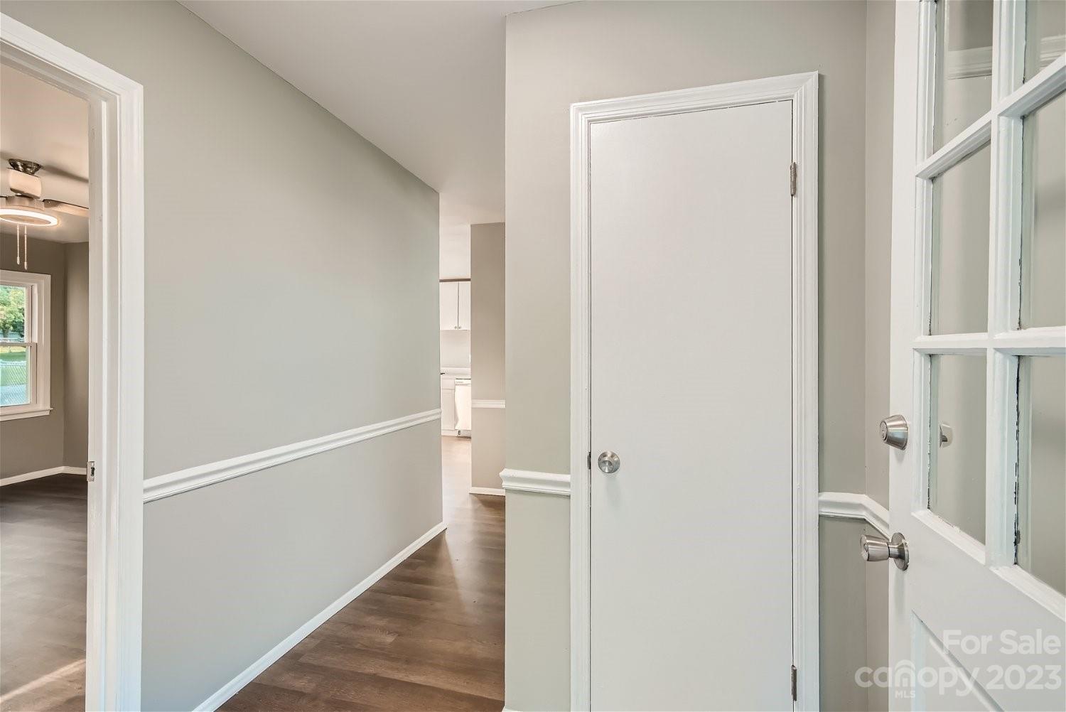 7438 Bramblewood Drive Charlotte, NC 28217 - Photo 4 of 27 a view of a hallway with a wooden floor