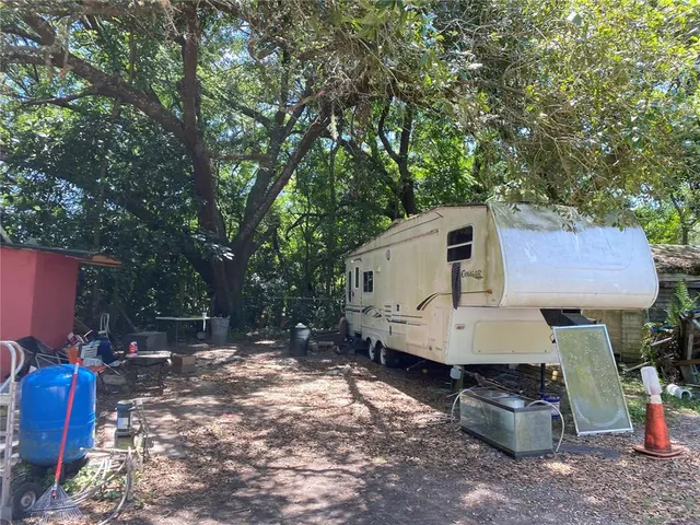 a view of a back yard of the house