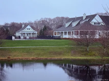 a view of a town with river and a building in the background