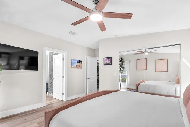 a bed room with a bed and a television