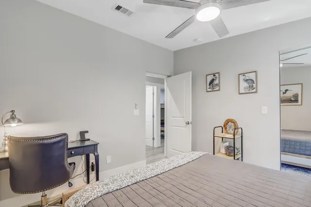 a bedroom with a bed and a table