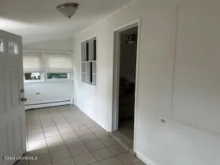 a view of a kitchen with a sink and cabinet