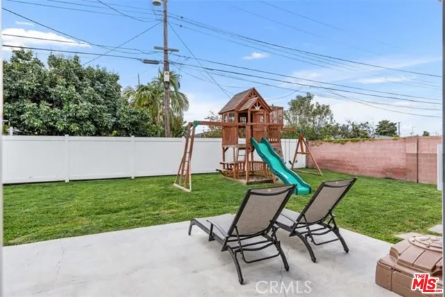 a view of a chair and table in the garden
