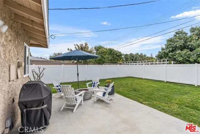 a view of yard with outdoor seating