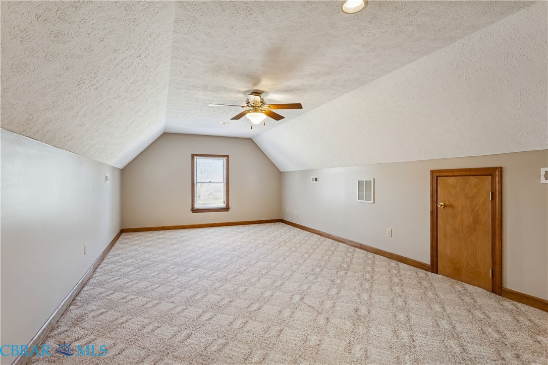 6253 Ark Road Gloucester, VA 23061 - Photo 22 of 38 Bonus room featuring a ceiling fan, carpet flooring, and a textured???????????????????????????????? ceiling