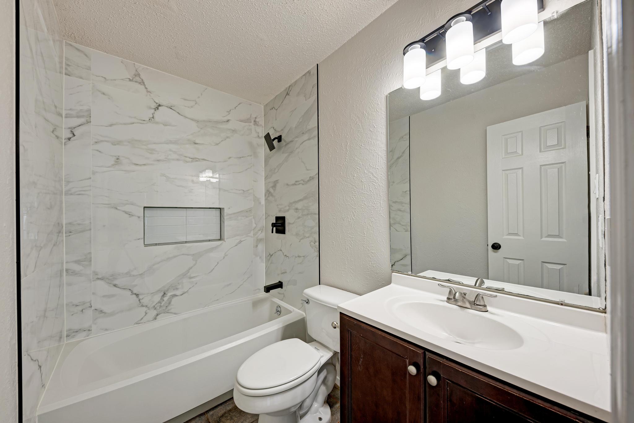 12108 Carnforth Drive Austin, TX 78753 - Photo 25 of 33 a bathroom with a sink a toilet and shower