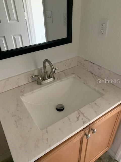 8893 White Sage Loop Lakewood Ranch, FL 34202 - Photo 9 of 14 a bathroom with a sink and a mirror