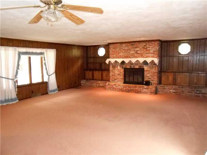600 Waynesburg Road Washington, PA 15301 - Photo 3 of 12 Living Room. Living room and dining room with log burning fireplace and sliding door to back yard.