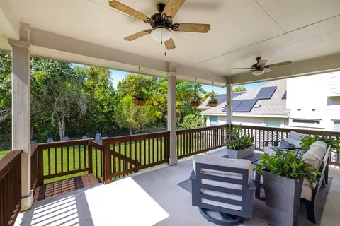 a view of a two chairs in the balcony