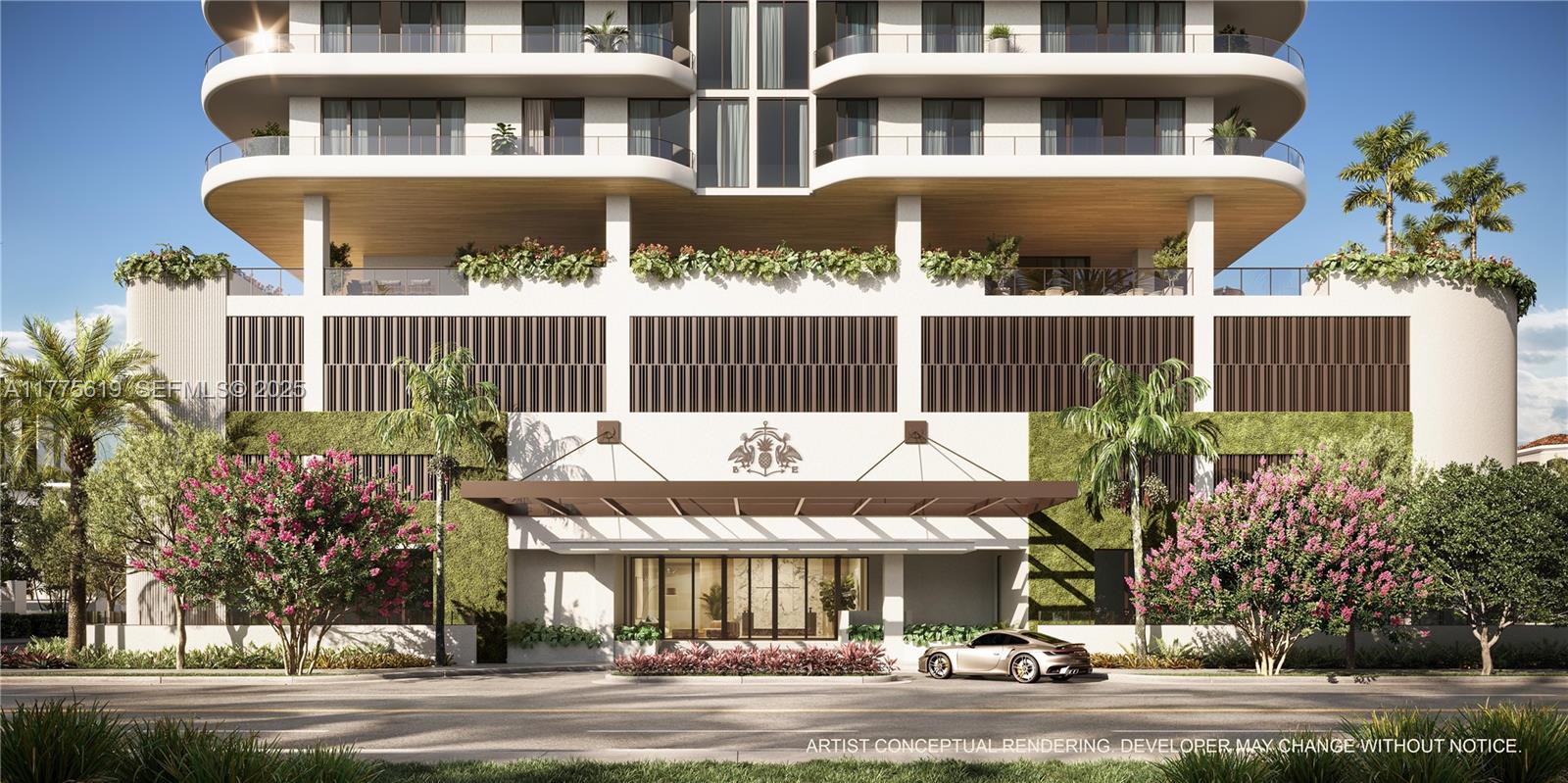 530 North Birch Road, Unit 601 Fort Lauderdale, FL 33304 - Photo 3 of 14 a front view of a building with a garden