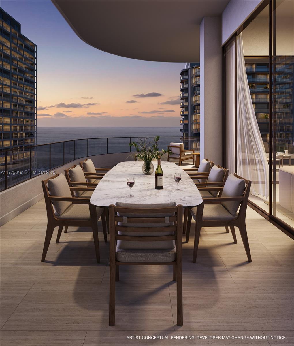 530 North Birch Road, Unit 601 Fort Lauderdale, FL 33304 - Photo 9 of 14 a view of an outside dining space with furniture