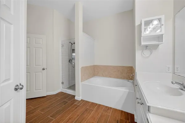 a bathroom with a bathtub and a sink