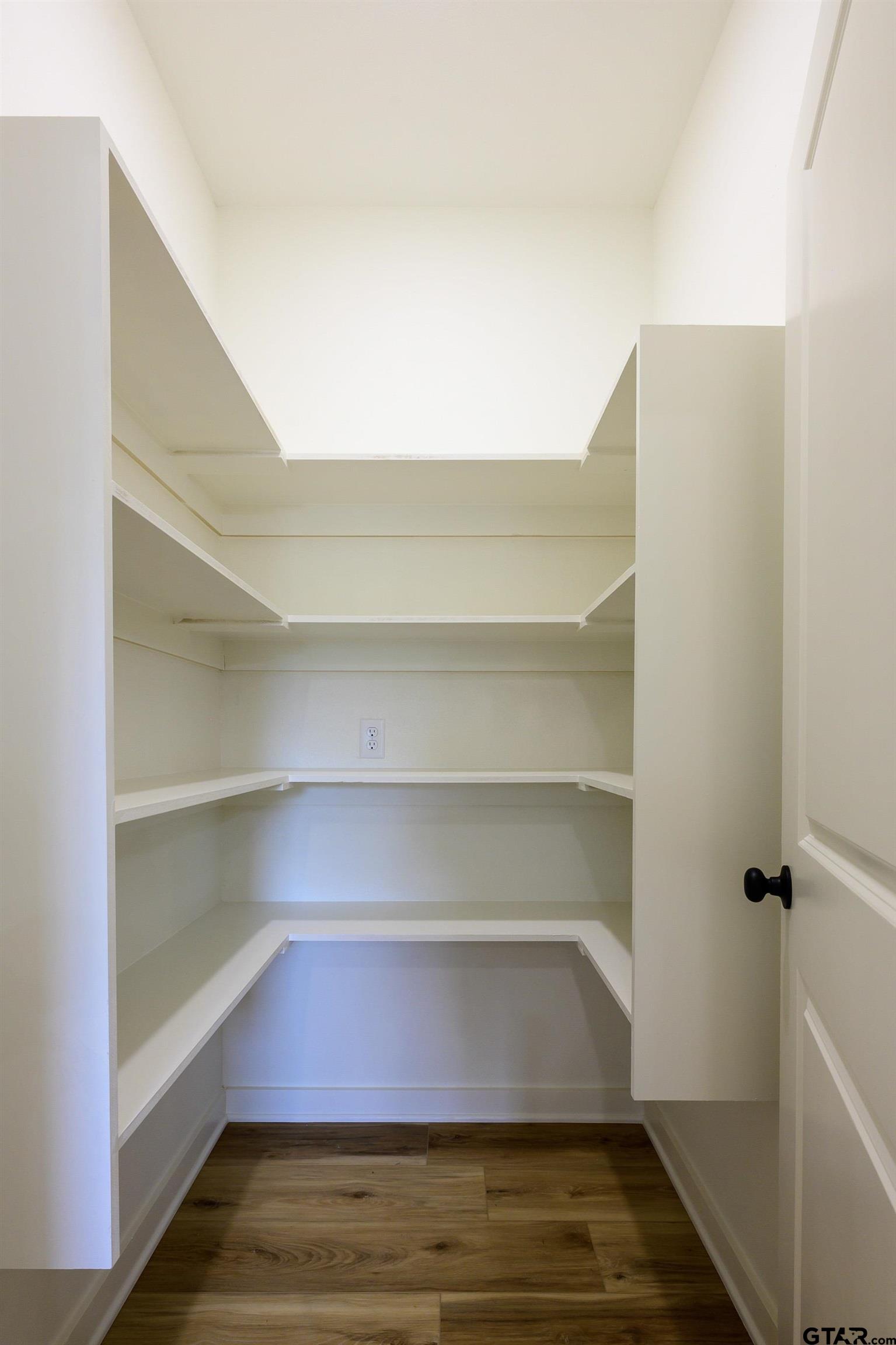 454 Crescent Bullard, TX 75757 - Photo 14 of 44 a view of walk in closet with empty racks