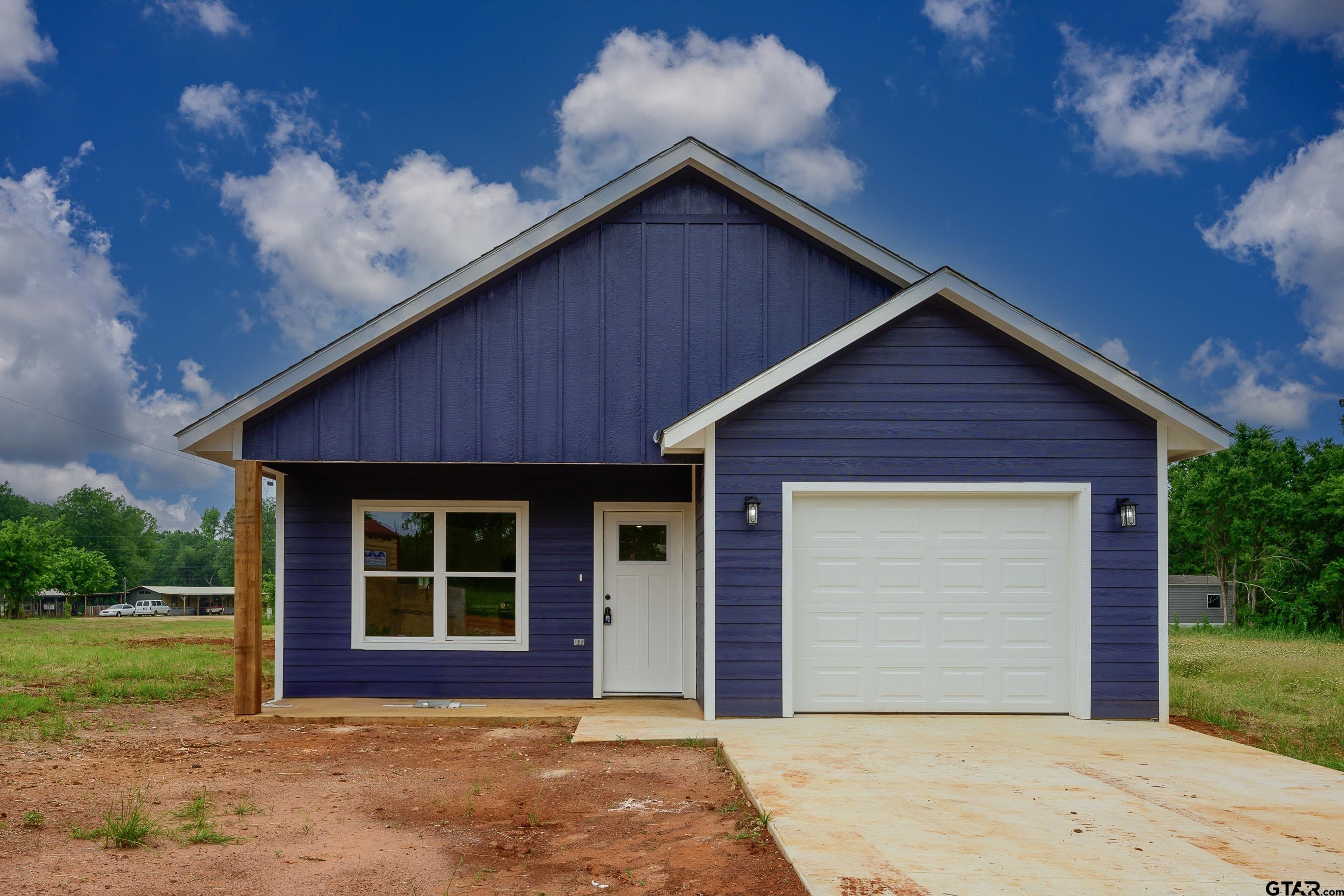 454 Crescent Bullard, TX 75757 - Photo 39 of 44 a front view of a house with a yard and garage