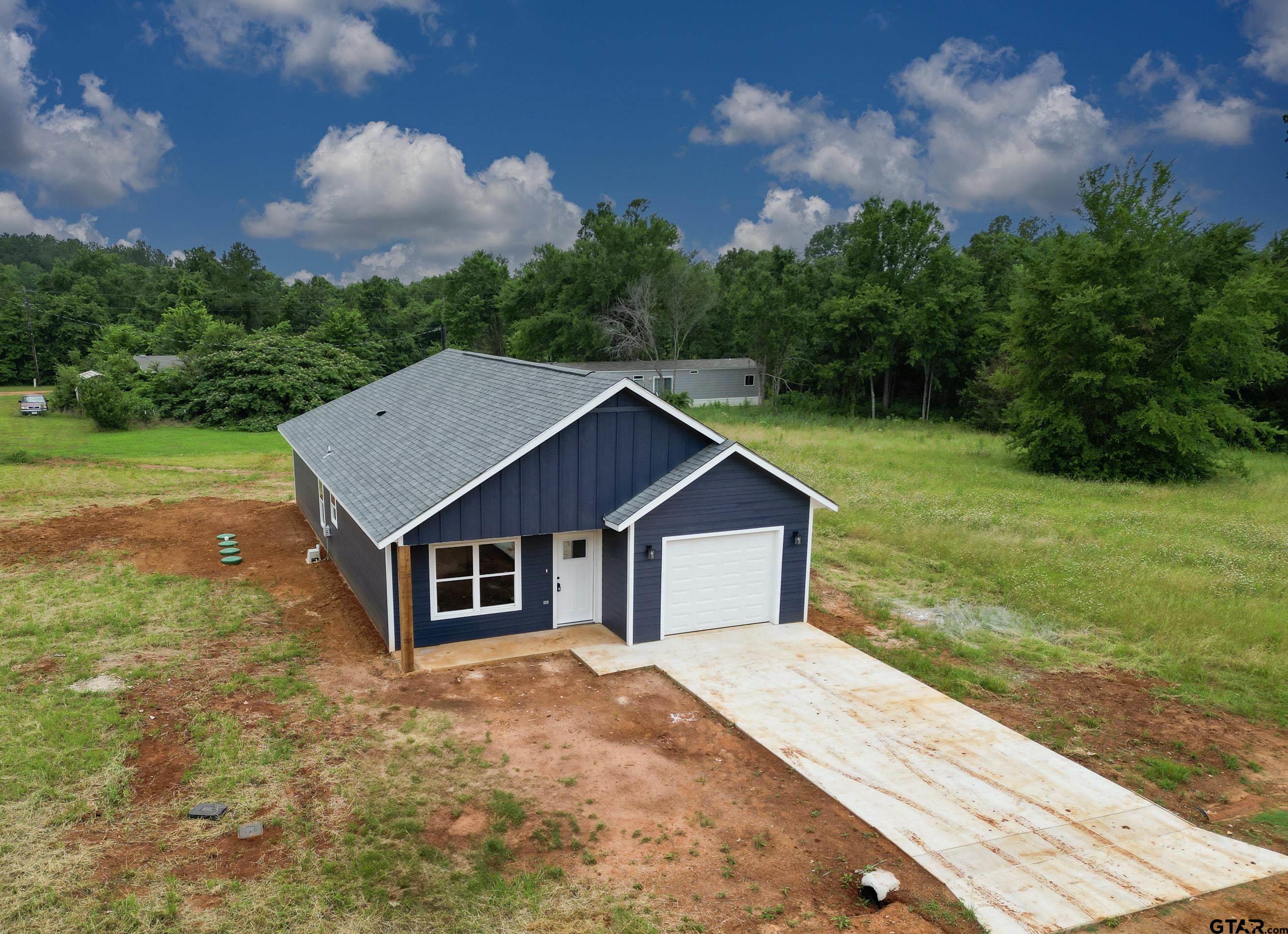454 Crescent Bullard, TX 75757 - Photo 41 of 44 a house with green field in front of it