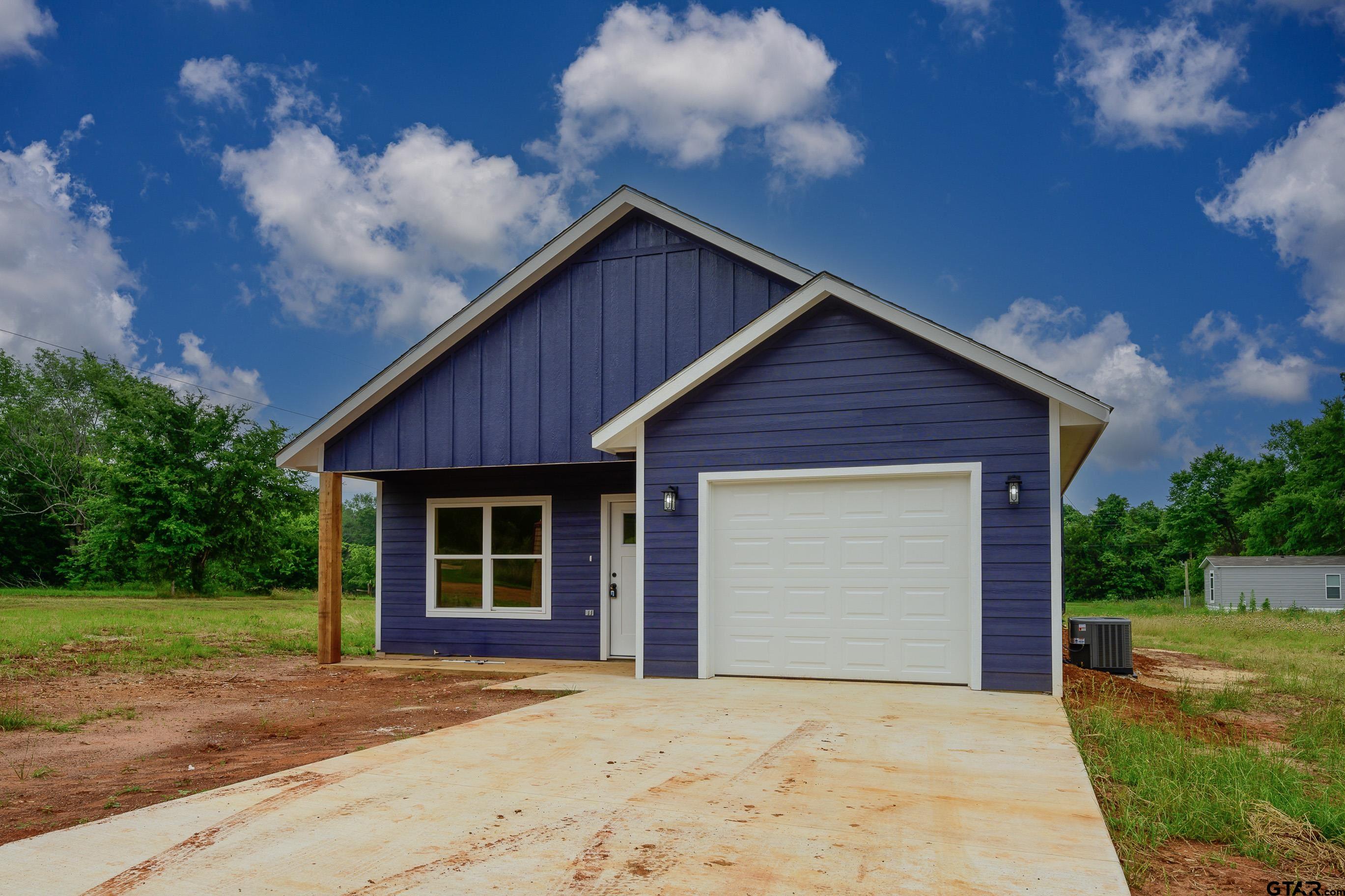 454 Crescent Bullard, TX 75757 - Photo 43 of 44 a front view of house with yard and trees in the background