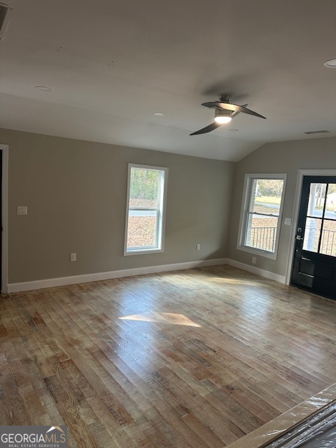 110 Fannin Road Griffin, GA 30223 - Photo 12 of 34 an empty room with wooden floor and windows