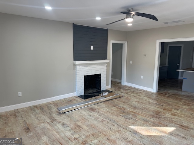 110 Fannin Road Griffin, GA 30223 - Photo 14 of 34 wooden floor in an empty room with a fireplace