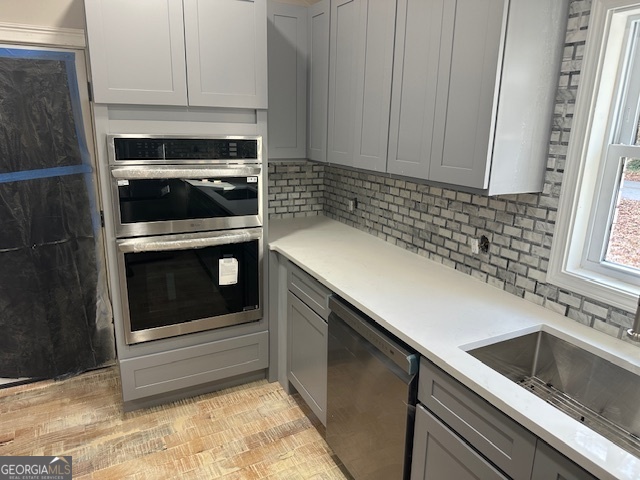110 Fannin Road Griffin, GA 30223 - Photo 18 of 34 a kitchen with granite countertop white cabinets and white stainless steel appliances