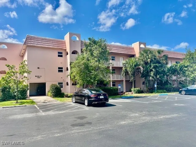 a view of a living room with furniture and a window