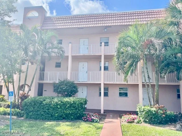 a view of a chairs and table in the balcony
